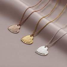 Image of 3 metal hammered heart pendant necklaces in silver, gold and rose gold