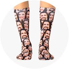Pair of legs with a pair of socks that have been personalised with photos of faces
