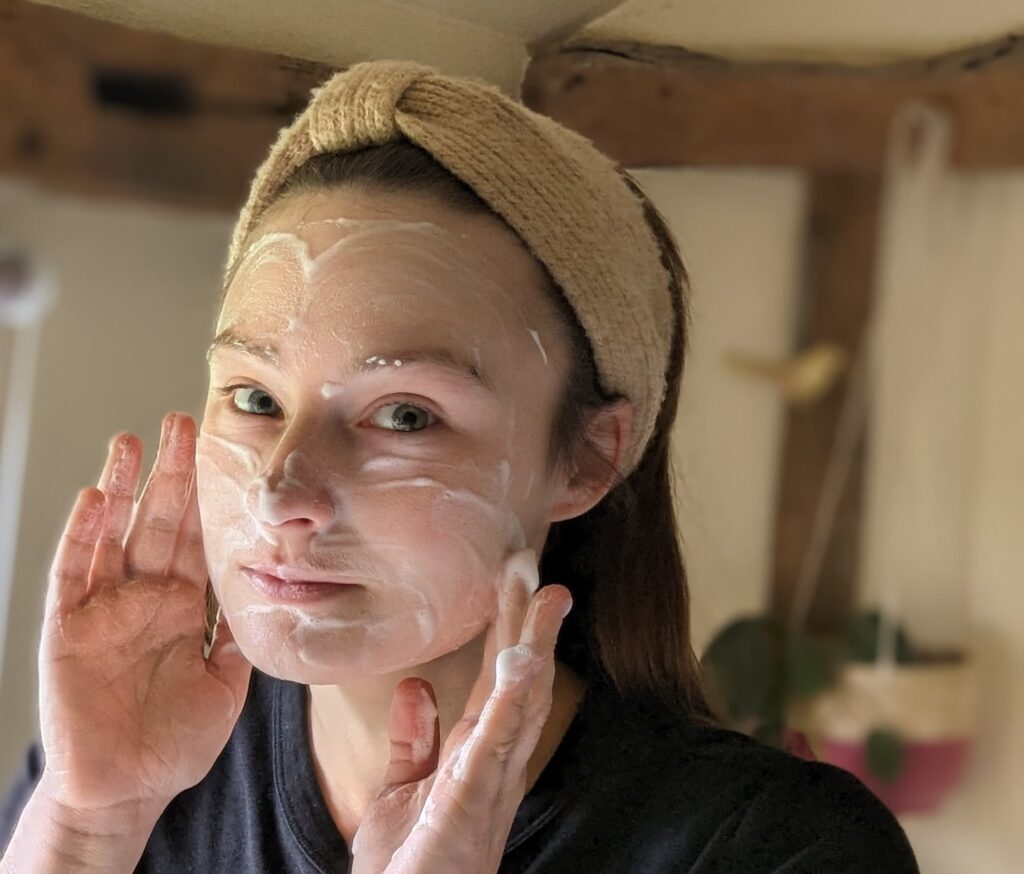 Model's face covered in Feel Skincare's micellar foaming facewash