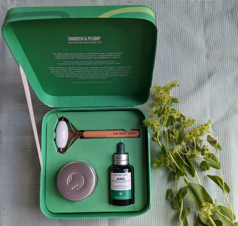 Open green gift box containing the Body Shop's edelweiss serum, day cream and ceramic roller for its application