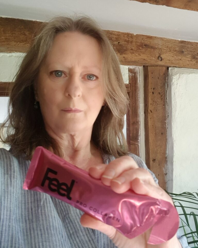 Vegan Mum holding a sachet of Feel Pro Collagen Gel