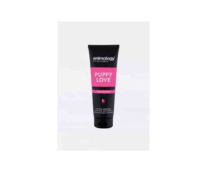 Black plastic tube of animology puppy shampoo with a bright pink stripe across the middle of the tube with white writing that says 'puppy love'