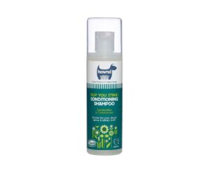 white Plastic bottle of Hownd shampoo for stinky dogs with clear cylindrical plastic lid. The bottle has a dark green label with a white stripe across the top with the Hownd logo - an outline of a dog - and a description of the contents below